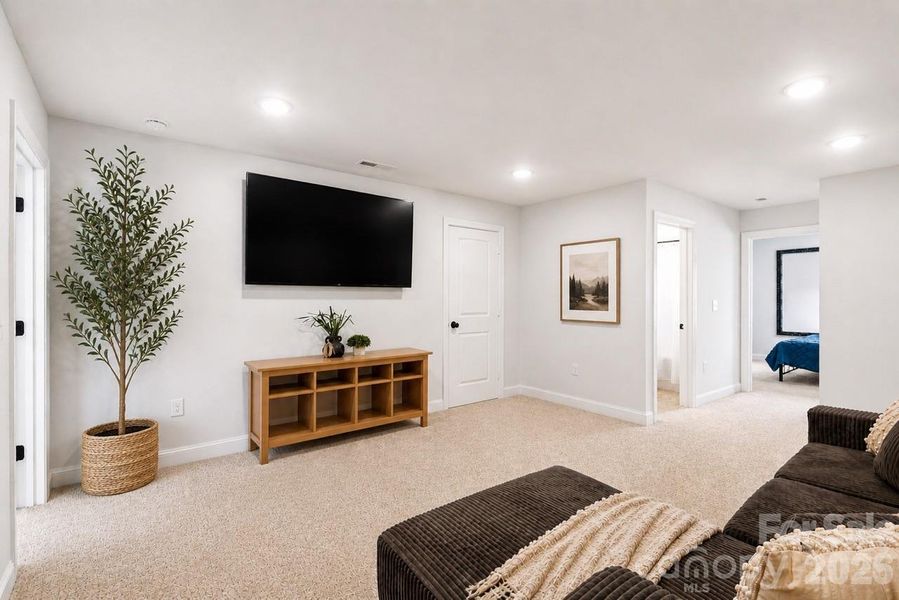Light-filled flex space with room to spread out, perfect for relaxing or entertaining.