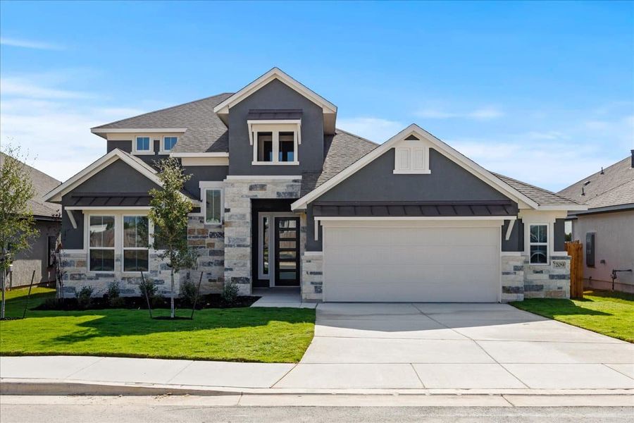 Front exterior of a new home in Village at Three Oaks, Seguin, TX, highlighting curb appeal (Image 2).