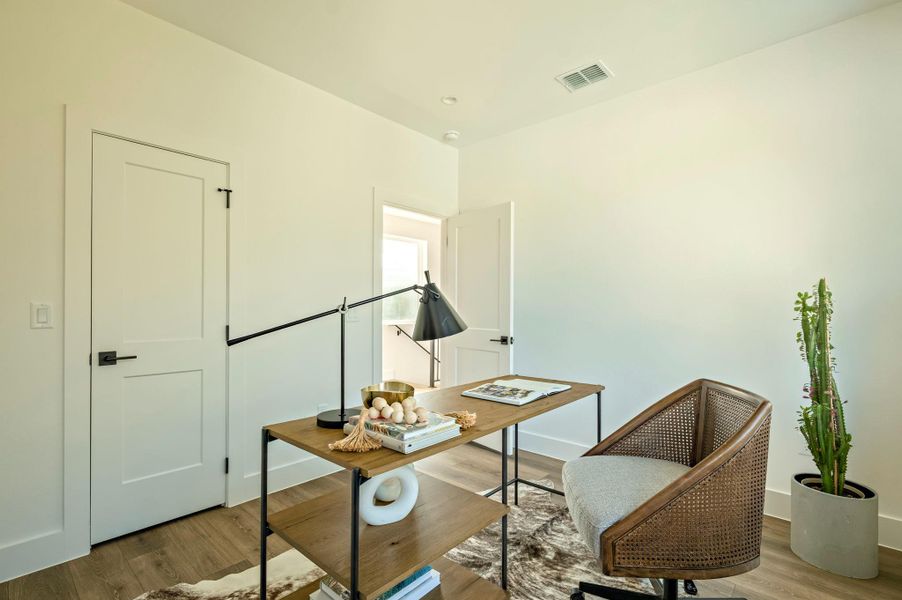 Secondary bedroom staged as an office Secondary bedroom staged as an office