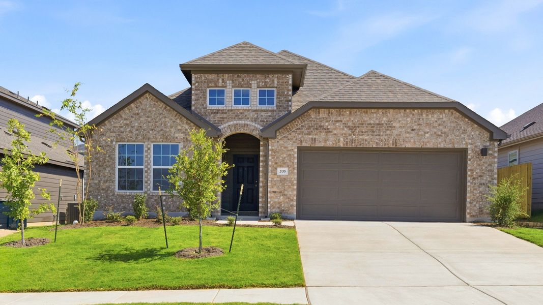 Front exterior of a new home in Hunters Glen, Jarrell, TX, highlighting curb appeal (Image 2). Front exterior of a new home in Hunters Glen, Jarrell, TX, highlighting curb appeal (Image 2).