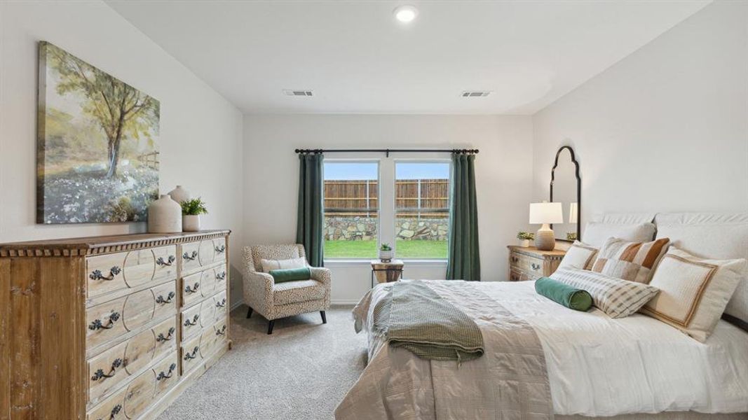 Bedroom with carpet and baseboards