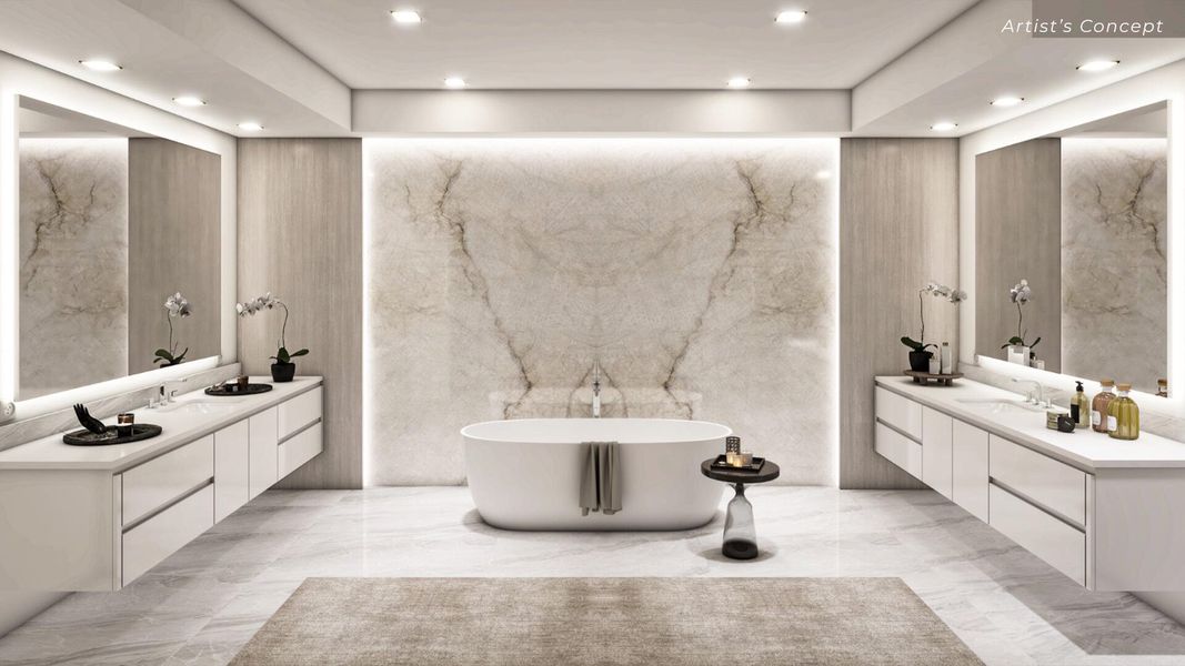 Master Bathroom with book matched feature wall and separate vanities.
