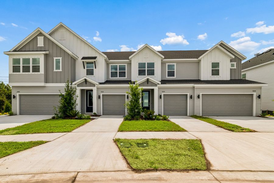 Front exterior of a new home in Waterset Townhomes, Apollo Beach, FL, highlighting curb appeal (Image 2). Front exterior of a new home in Waterset Townhomes, Apollo Beach, FL, highlighting curb appeal (Image 2).