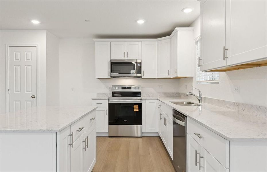 Spacious eat-in kitchen designed with a large island for dining Spacious eat-in kitchen designed with a large island for dining