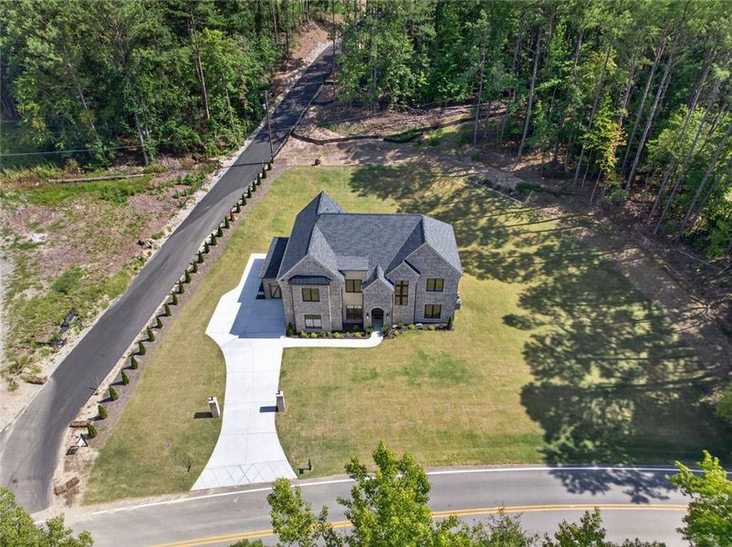 Front exterior of a new home in , Dacula, GA, highlighting curb appeal (Image 25). Front exterior of a new home in , Dacula, GA, highlighting curb appeal (Image 25).