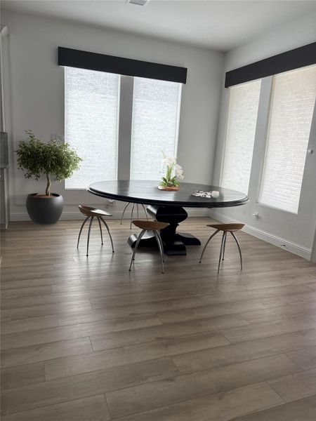 Bright dining area opens to the spacious living area creating a stylish and inviting space.