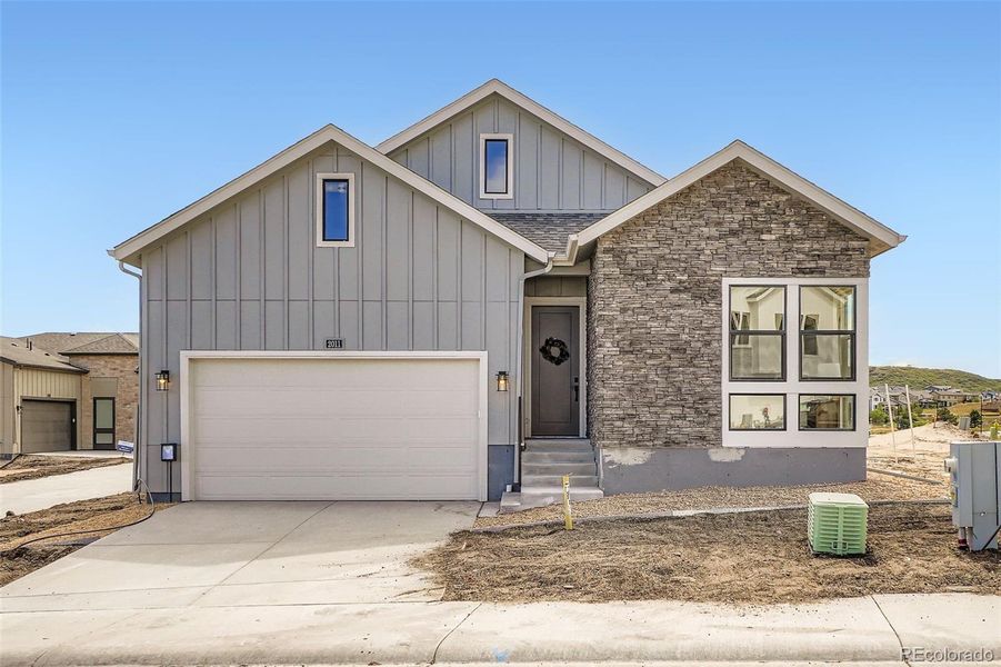 Front exterior of a new home in Hillside at Castle Rock, Castle Rock, CO, highlighting curb appeal (Image 1).