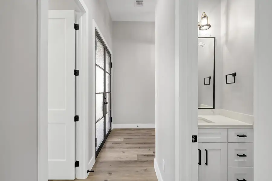 Half bathroom across from study in the front of the house