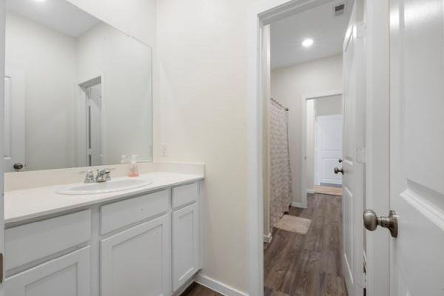 Furnished interior view inside a new home in Sterling Point at Baytown Crossings: Wildflower II Collection, Baytown (Image 13).