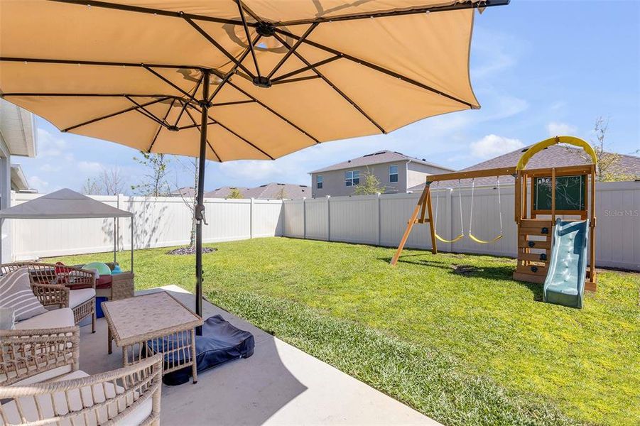 Exterior details and patio area of a home in Groveside at Ormond Station, Ormond Beach (Image 27).