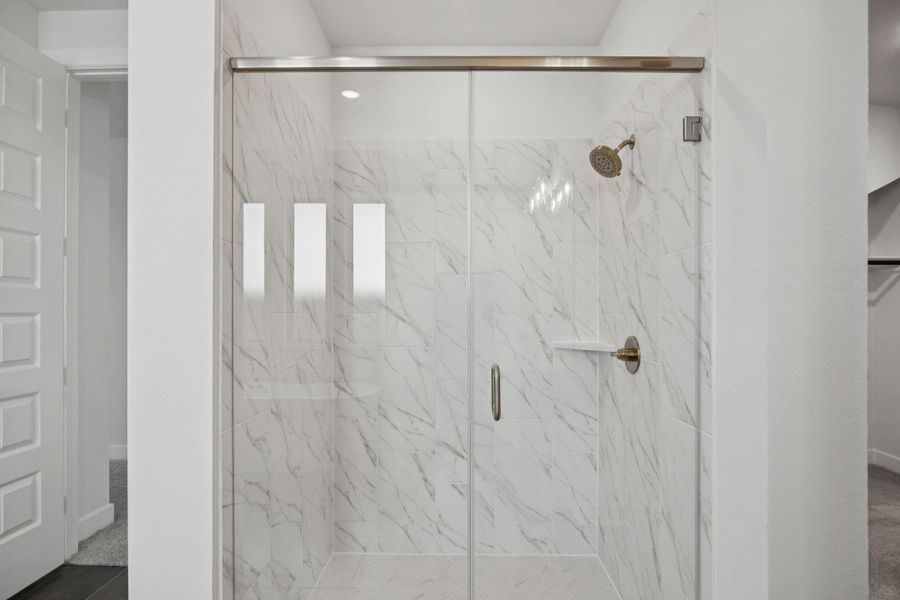 Your private bath features an oversized glass-enclosed shower with beautiful tile work that creates the perfect blend of modern style and relaxation. Your private bath features an oversized glass-enclosed shower with beautiful tile work that creates the perfect blend of modern style and relaxation.