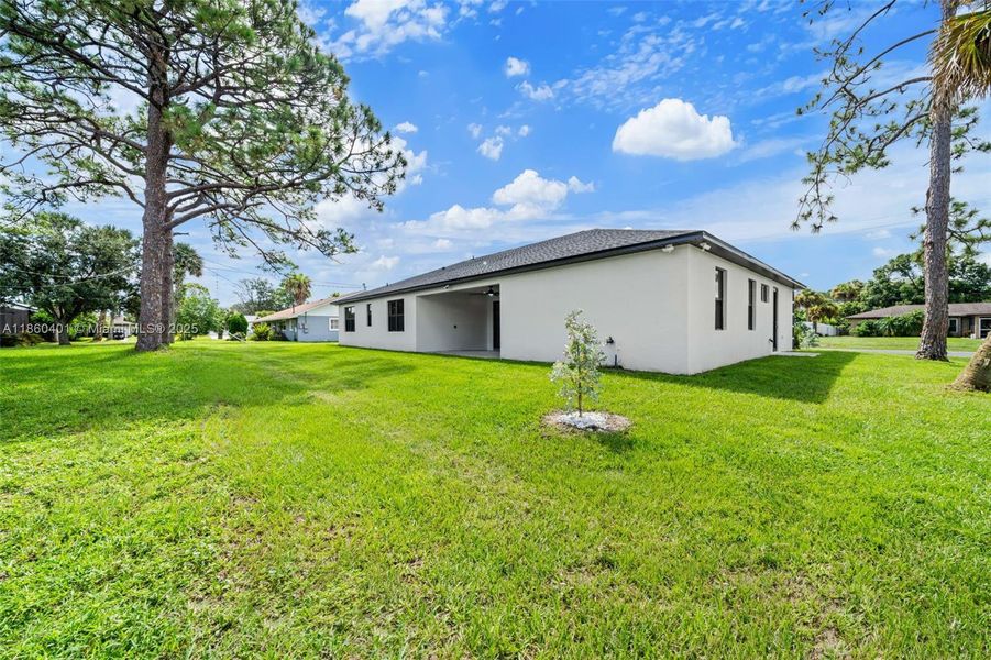 Front exterior of a new home in , Palm Bay, FL, highlighting curb appeal (Image 2).