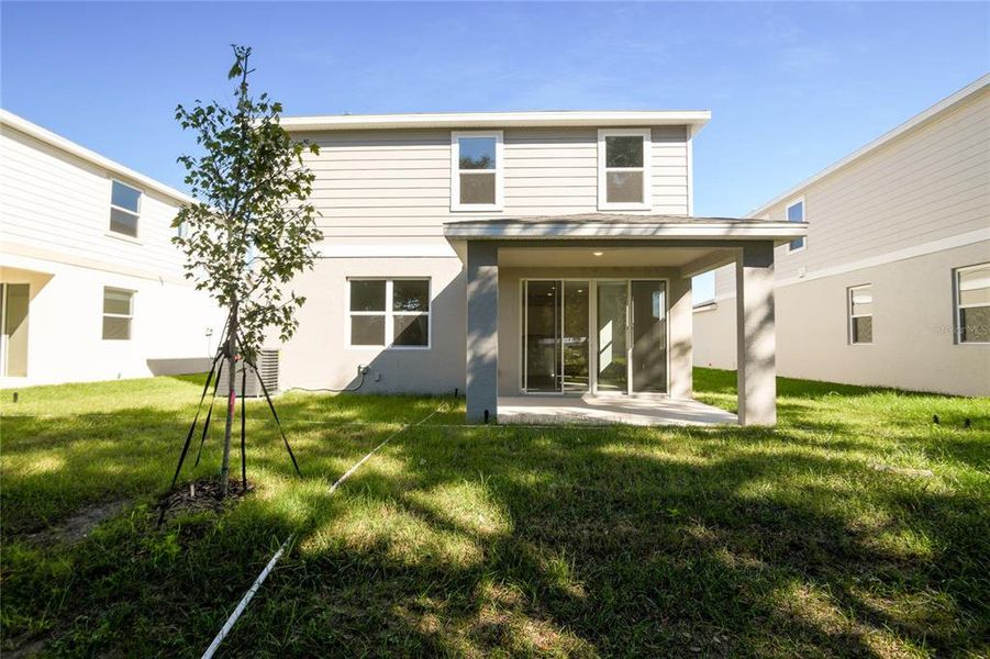 Exterior details and patio area of a home in Seasons at Shores of Lake Dell, Dundee (Image 3).