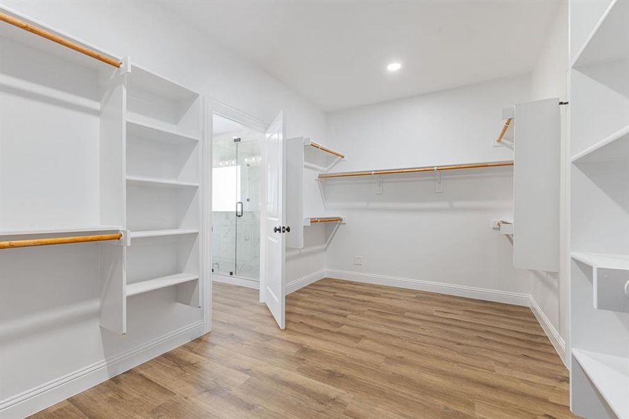 Walk in closet featuring light wood-type flooring