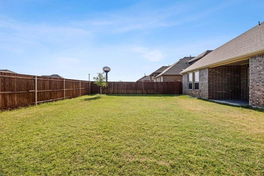 Exterior details and patio area of a home in , Aubrey (Image 24).