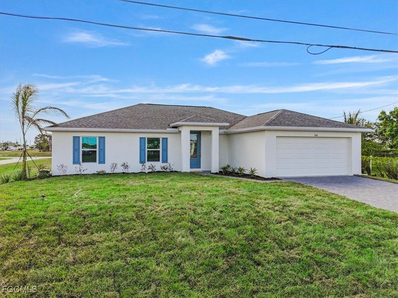 Front exterior of a new home in Cape Coral, Cape Coral, FL, highlighting curb appeal (Image 2). Front exterior of a new home in Cape Coral, Cape Coral, FL, highlighting curb appeal (Image 2).