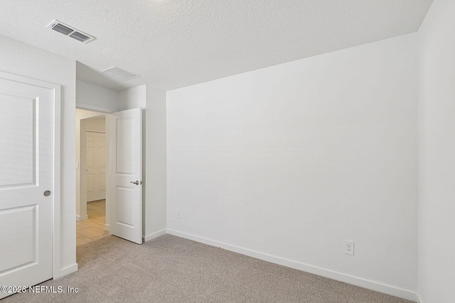 Spacious, unfurnished interior of a new home in Colbert Landings, Palm Coast (Image 33).