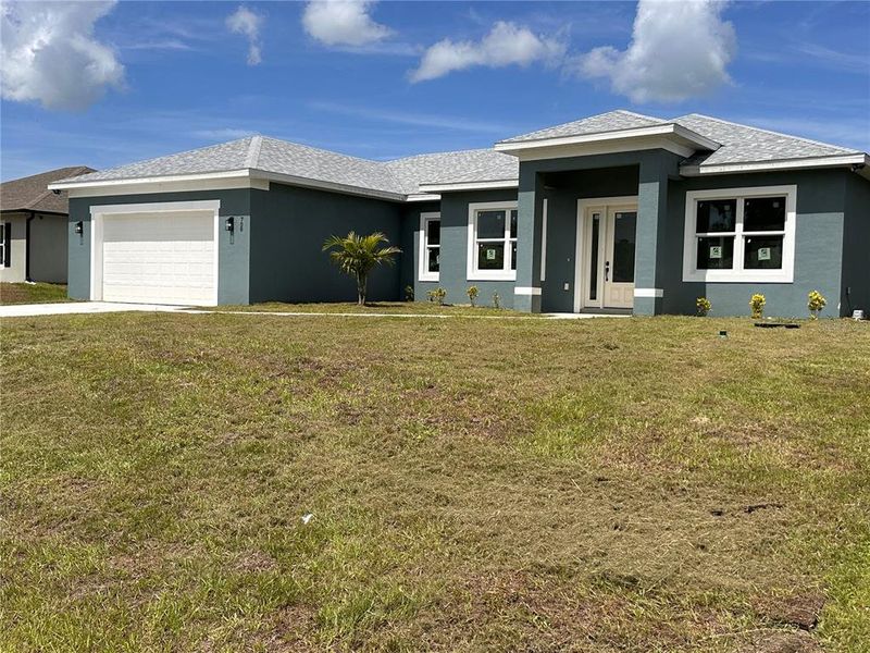 Front exterior of a new home in , Palm Bay, FL, highlighting curb appeal (Image 31). Front exterior of a new home in , Palm Bay, FL, highlighting curb appeal (Image 31).