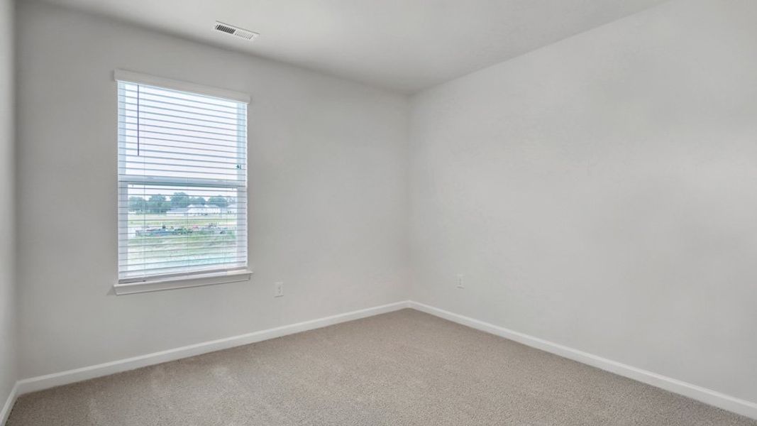 Spacious, unfurnished interior of a new home in The Townes at Honeycutt Oaks, Angier (Image 23).