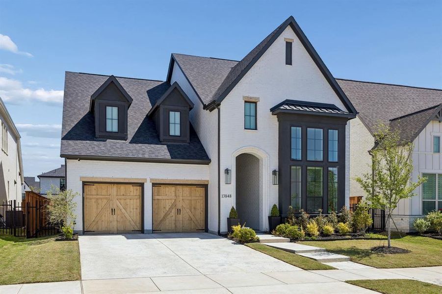 Front exterior of a new home in Fields 50', Frisco, TX, highlighting curb appeal (Image 2). Front exterior of a new home in Fields 50', Frisco, TX, highlighting curb appeal (Image 2).