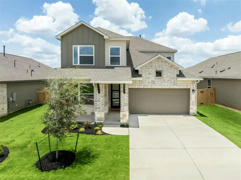 Front exterior of a new home in East View Farms, Georgetown, TX, highlighting curb appeal (Image 21).