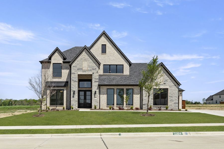 Front exterior of a home in the Winding Creek community, located in Rockwall, TX (Image 6).