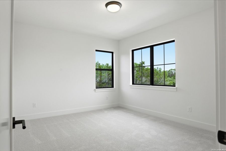 Spacious, unfurnished interior of a new home in Enchanted Bluff, San Antonio (Image 47).