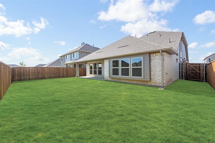Front exterior of a new home in Woodstone, Providence Village, TX, highlighting curb appeal (Image 2). Front exterior of a new home in Woodstone, Providence Village, TX, highlighting curb appeal (Image 2).