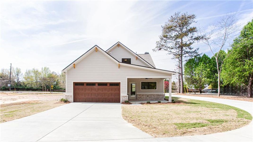 Front exterior of a new home in , Grayson, GA, highlighting curb appeal (Image 26).