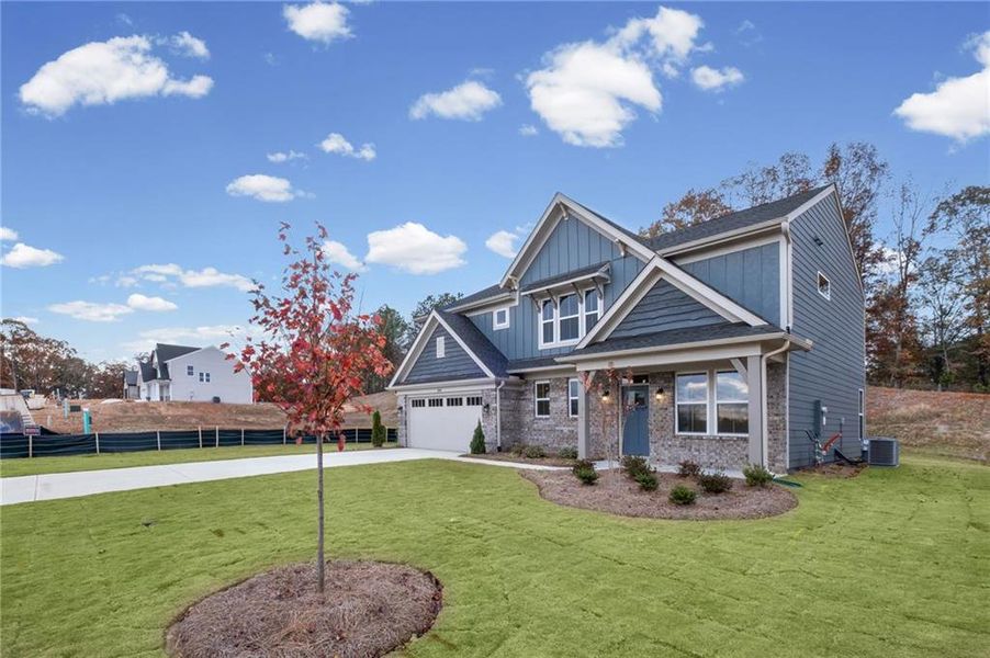 Front exterior of a new home in Pickens Bluff, Hiram, GA, highlighting curb appeal (Image 24).