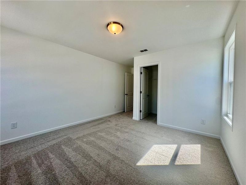 Spacious, unfurnished interior of a new home in Eastlyn Crossing, Flowery Branch (Image 24).
