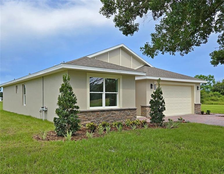 Front exterior of a new home in , Sebring, FL, highlighting curb appeal (Image 2). Front exterior of a new home in , Sebring, FL, highlighting curb appeal (Image 2).
