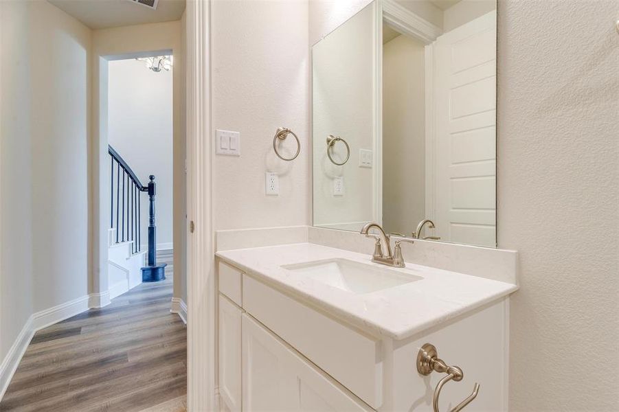 Bathroom with vanity and hardwood / wood-style flooring