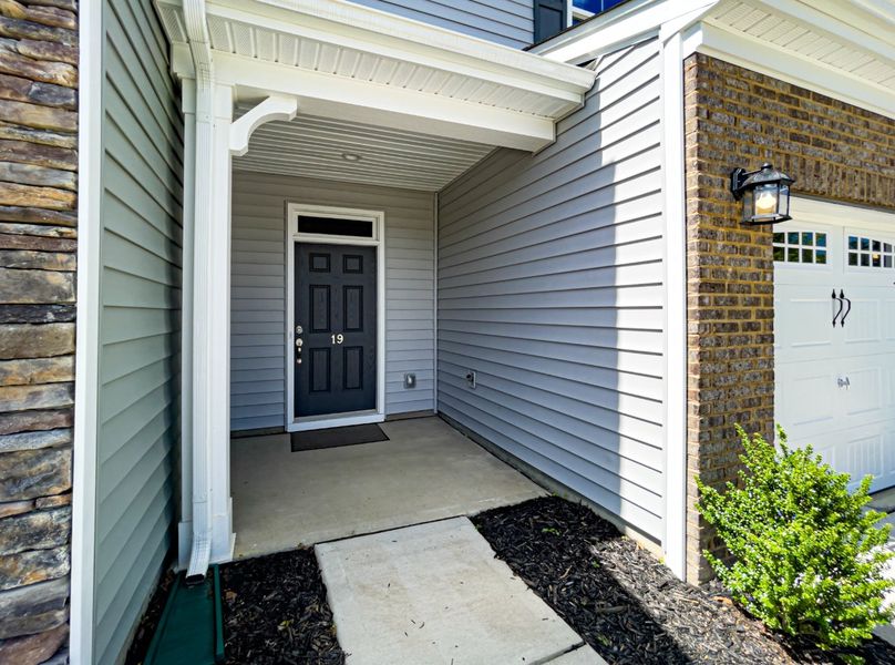 Front exterior of a new home in Fairview Village Townhomes, Simpsonville, SC, highlighting curb appeal (Image 2).