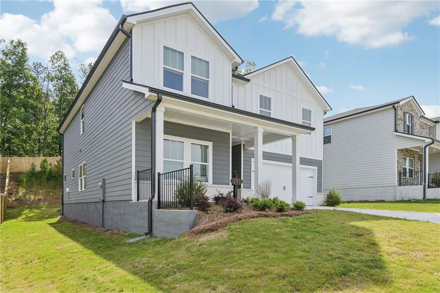 Front exterior of a new home in Ivey Township, Dallas, GA, highlighting curb appeal (Image 25).