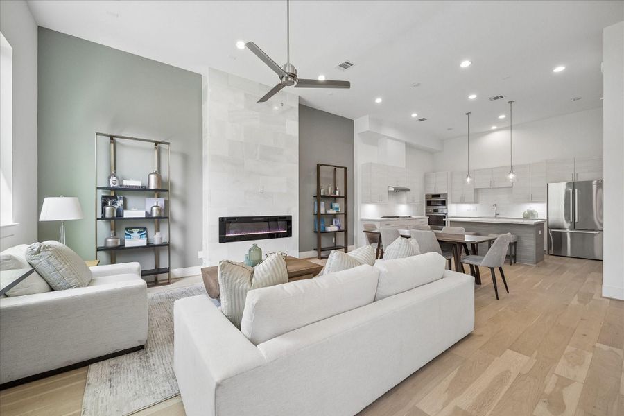 Wow! First floor living with floor to ceiling marble surrounding a linear electric fireplace. Wow! First floor living with floor to ceiling marble surrounding a linear electric fireplace.