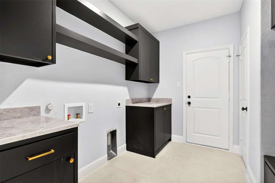 Laundry area featuring washer hookup, cabinet space, and hookup for an electric dryer