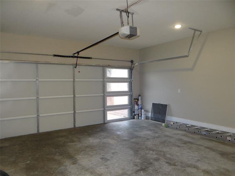 2-Car Garage featuring a garage door opener