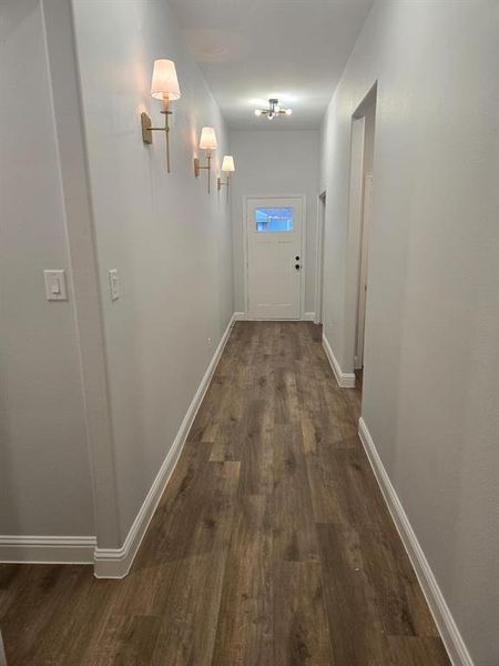 Hallway featuring dark hardwood / wood-style flooring