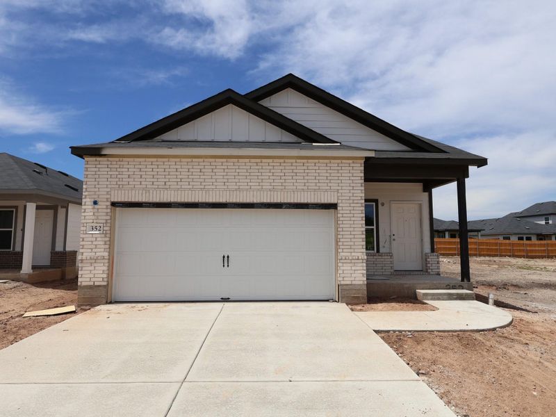 Front exterior of a new home in Cool Water, Jarrell, TX, highlighting curb appeal (Image 1). Front exterior of a new home in Cool Water, Jarrell, TX, highlighting curb appeal (Image 1).