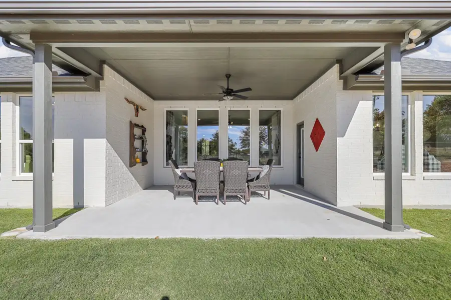 Exterior details and patio area of a home in Arbor Oaks, Boyd (Image 3). Exterior details and patio area of a home in Arbor Oaks, Boyd (Image 3).