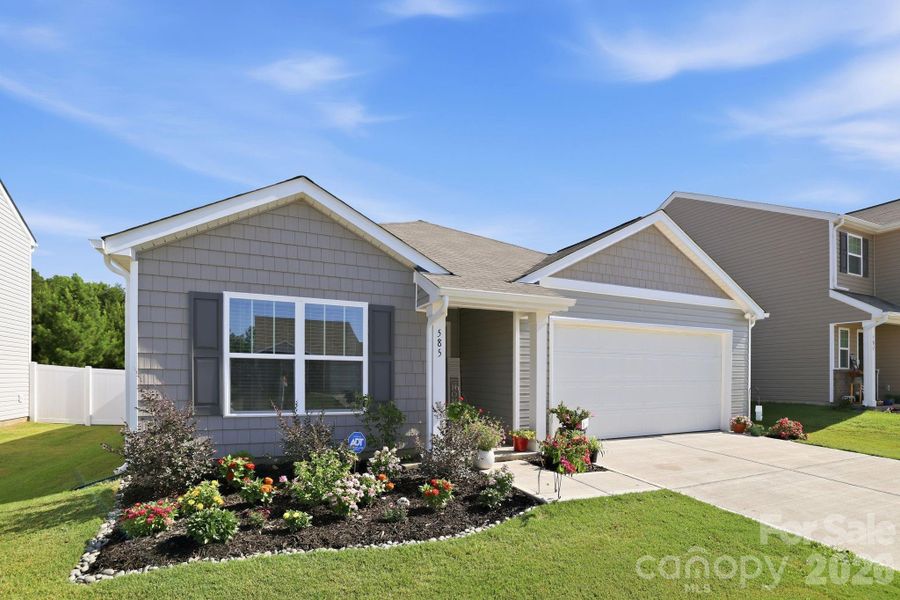Front exterior of a new home in Woodhaven at Chester, Chester, SC, highlighting curb appeal (Image 24).