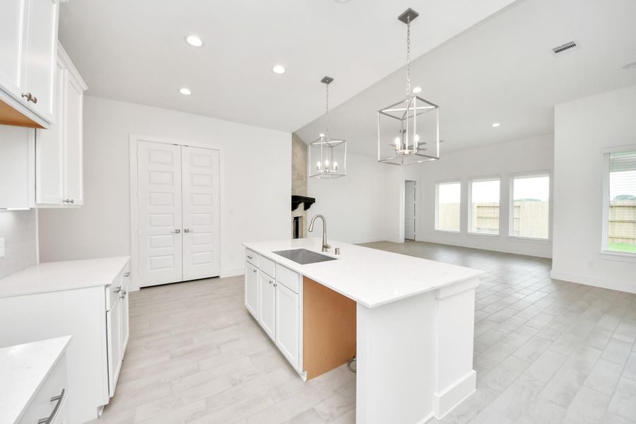 All of this overlooks your expansive family room, creating a perfect space for culinary delights and family gatherings. All of this overlooks your expansive family room, creating a perfect space for culinary delights and family gatherings.
