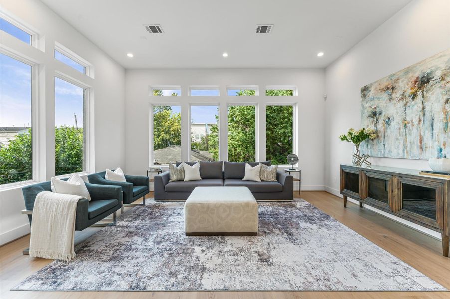 This spacious, sun-filled living area seamlessly blends comfort and style-ideal for entertaining friends or relaxing in everyday luxury