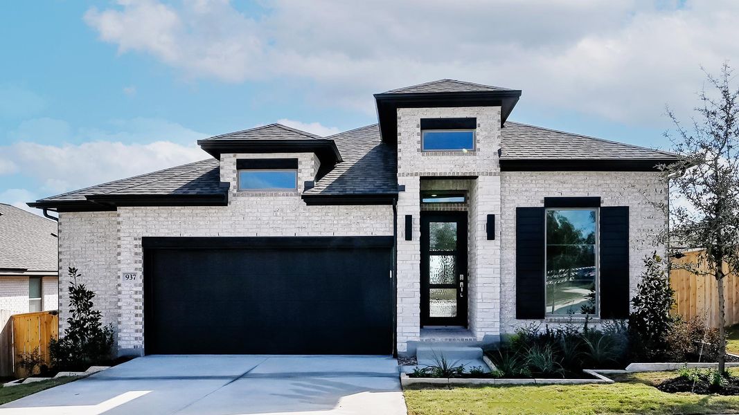 Front exterior of a new home in La Cima 50', San Marcos, TX, highlighting curb appeal (Image 22). Front exterior of a new home in La Cima 50', San Marcos, TX, highlighting curb appeal (Image 22).