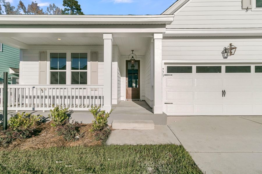 Exterior details and patio area of a home in Tidewater at Lakes of Cane Bay, Summerville (Image 25).