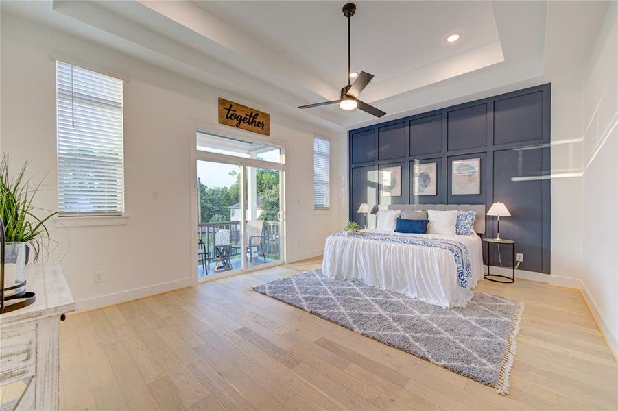 Breathtaking primary suite features a double tray ceiling, private balcony and more!