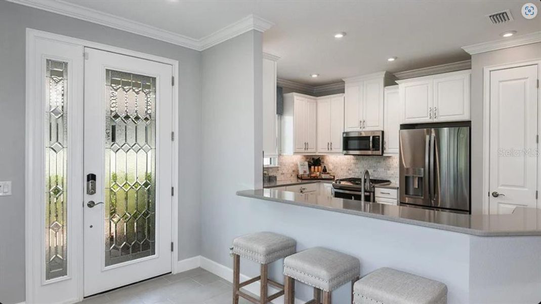 Furnished interior view inside a new home in Esplanade at Azario Lakewood Ranch, Bradenton (Image 6).