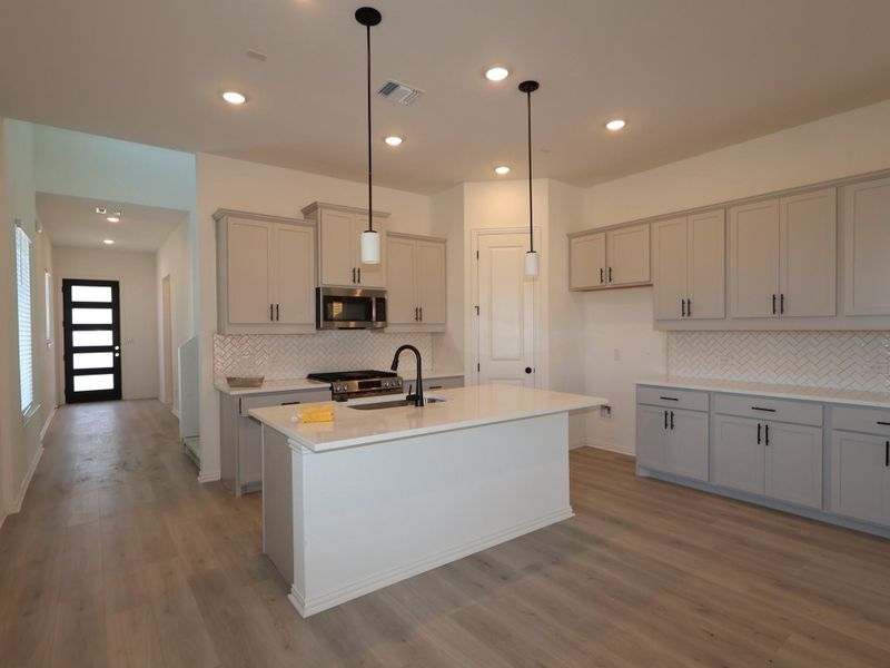 Furnished interior view inside a new home in Heritage, Dripping Springs (Image 6).
