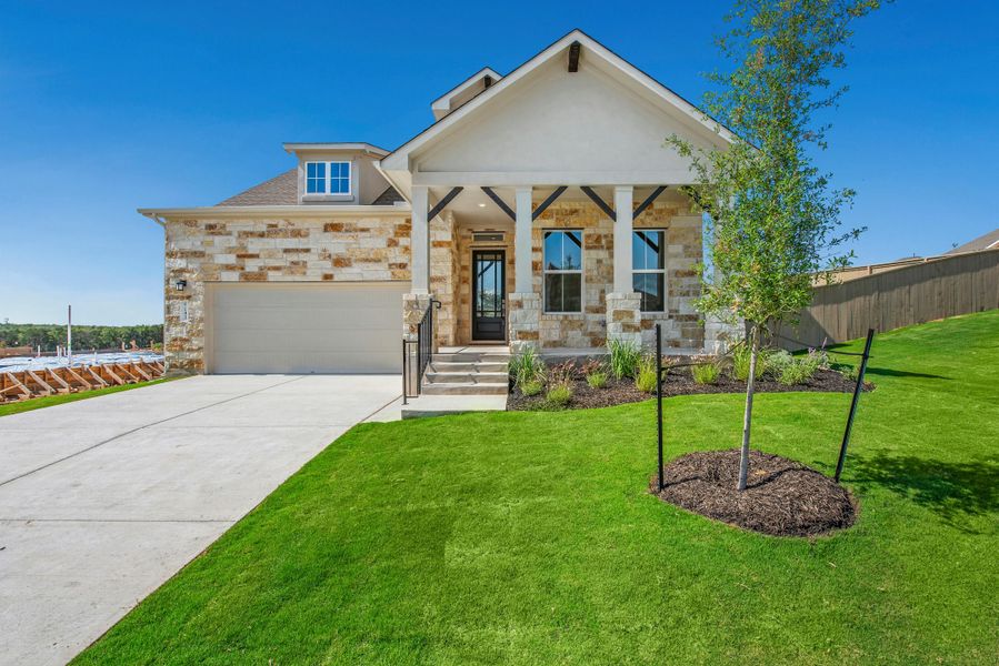 Front exterior of a new home in The Colony, Bastrop, TX, highlighting curb appeal (Image 20). Front exterior of a new home in The Colony, Bastrop, TX, highlighting curb appeal (Image 20).